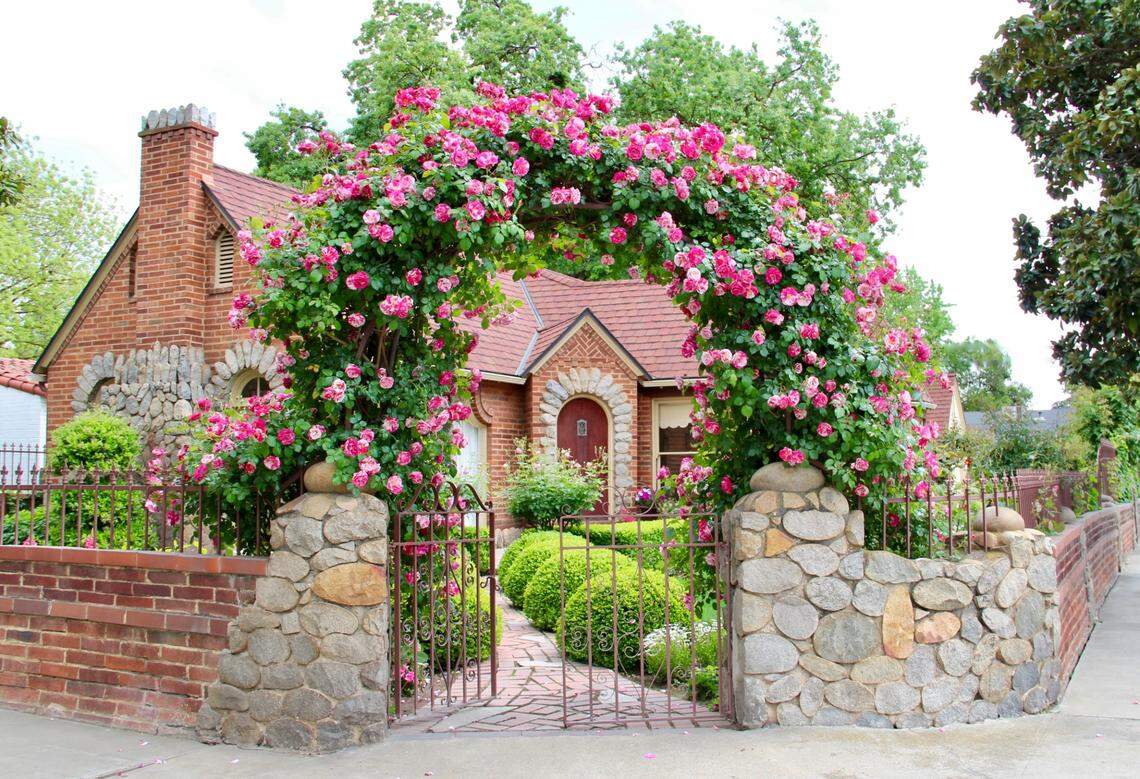 A rose-covered arch marks the entrance to this storybook Tudor cottage at 304 East Simpson Ave. in Fresno. It’s on the market for $455,000.