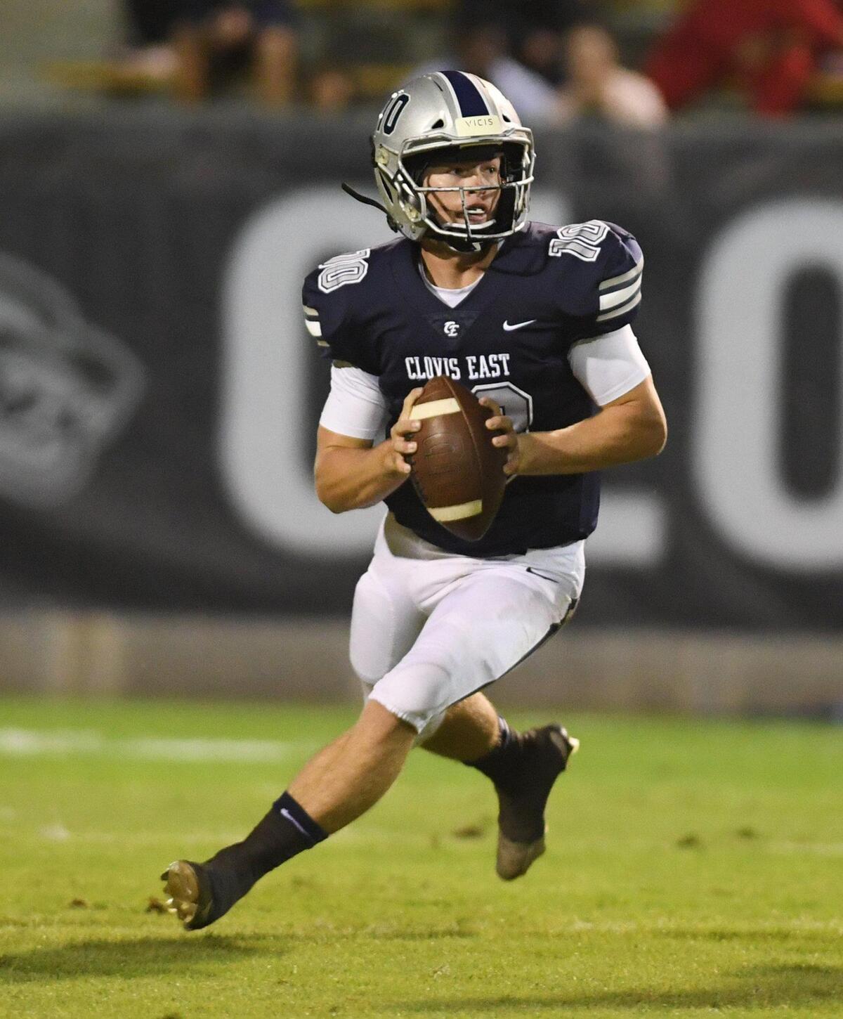 Clovis East quarterback Tyus Miller looks to pass during their TRAC opener against Clovis Northt at Lamonica Stadium on Friday, Sept. 29, 2023.