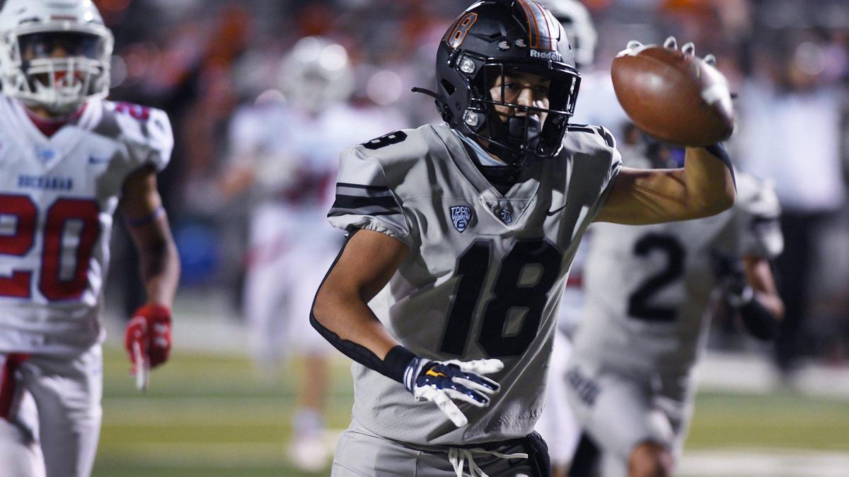 File photo of Central WR Braylen Hall making a catch and runs to the end zone for a touchdown on March 26, 2021 in Fresno.