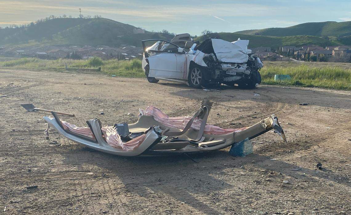 The roof of a Honda Accord rests on the ground after it was cut away for emergency crews to rescue two people after a head-on crash early Saturday, Feb. 5, 2022, on Millerton Road northeast of Fresno. A passenger in the Honda was killed, as were four men in a Hyundai Accent.