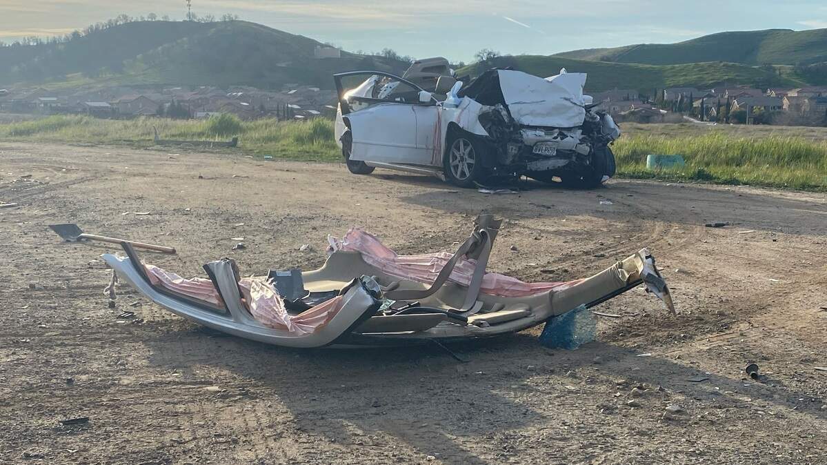 The roof of a Honda Accord rests on the ground after it was cut away for emergency crews to rescue two people after a head-on crash early Saturday, Feb. 5, 2022, on Millerton Road northeast of Fresno. A passenger in the Honda was killed, as were four men in a Hyundai Accent.