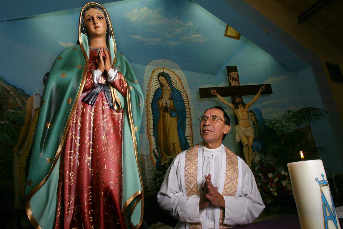 Father Gaspar Bautista prays to the Virgin of Guadalupe at Our Lady of Guadalupe Church in Mendota in this 2004 photo.Diana Baldrica/The Fresno Bee