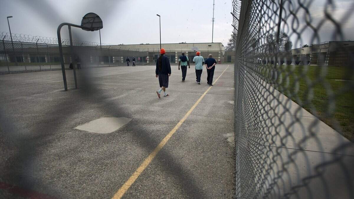 Inmates walk the facility yard at the John Latorraca Correctional Facility in El Nido, Calif., Friday, Jan. 9, 2015. The inmate population has decreased by more than 25 percent in Merced County, following the passing of California Proposition 47, the Reduced Penalties For Some Crimes Initiative. The proposition calls for misdemeanors rather than felonies, for some nonviolent crimes.