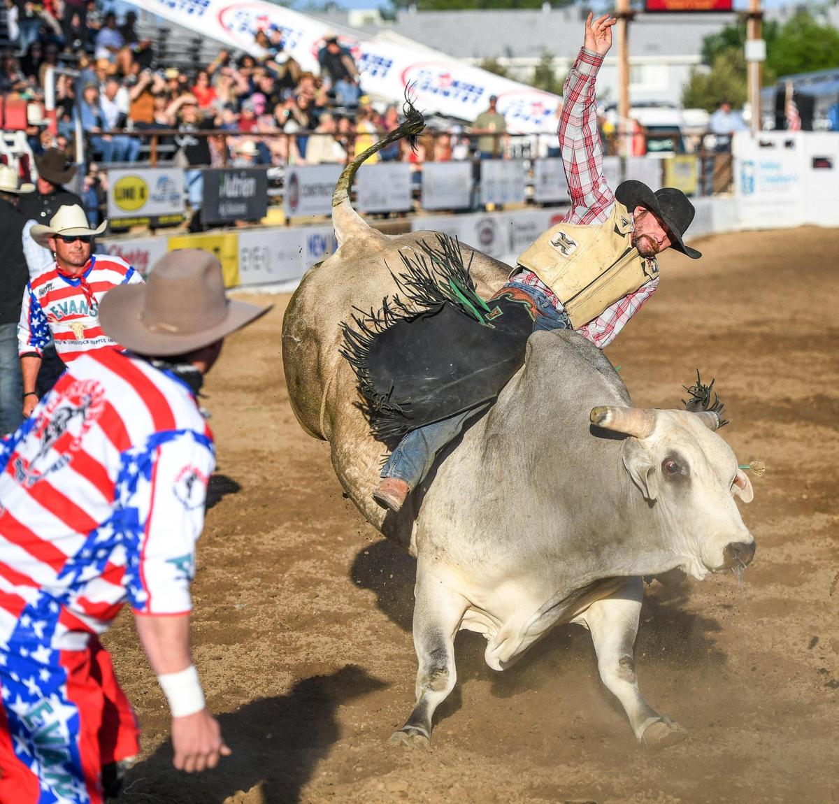 Gage Gay rides Rock Salt & Nails in the first section of bull riding during the Professional Bull Riders event on the opening day of the Clovis Rodeo on Wednesday, April 20, 2022.