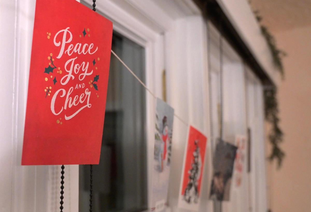 Christmas cards reflect holiday cheer in a home during the 2024 Fresno High Neighborhood Holiday Home Tour Monday evening, Dec. 2, 2024 in Fresno. The home tour which required tickets featured four private homes and a stop at the Towet Theatre. The tour opened with a pre-tour gathering at Moto Delicatessen & Bodega at 4 p.m. The Tower Theatre, which celebrates its 85th year, opened December 14, 1939.