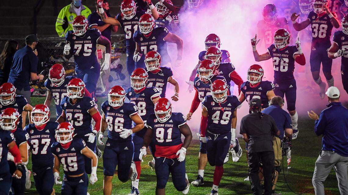Fresno State runs out onto the field before their game against Colorado State at Bulldog Stadium on Thursday, Oct. 29, 2020.