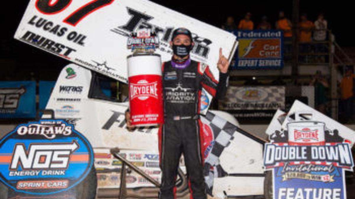 Kyle Larson celebrates victory Saturday night in a World of Outlaws sprint car race.