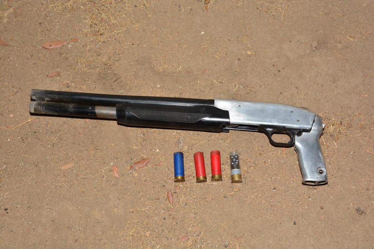 A loaded, sawed-off shotgun was recovered early Thursday by police from a man who allegedly fled from officers on a bicycle.