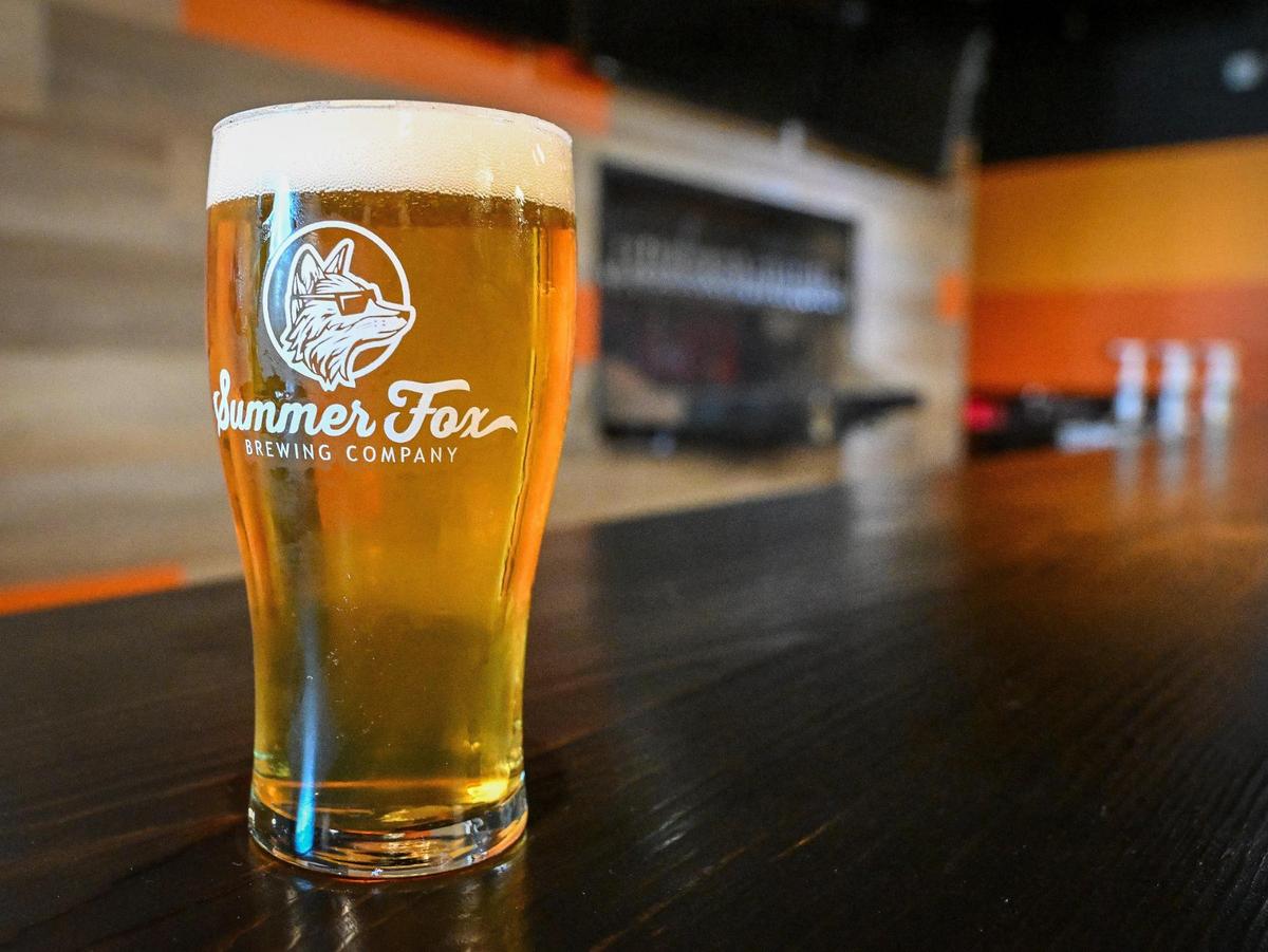 A draft beer from Summer Fox sits on the bar at their new location in the old Club Fred and Audie’s Olympic in the Van Ness Village area of the Tower District in Fresno.