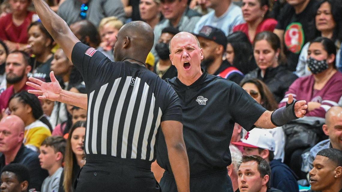 Clovis West head boys basketball coach Vance Walberg complains to the ref about a call during their Central Section Open Division championship game against St. Joseph at Clovis West on Saturday, Feb. 26, 2022.