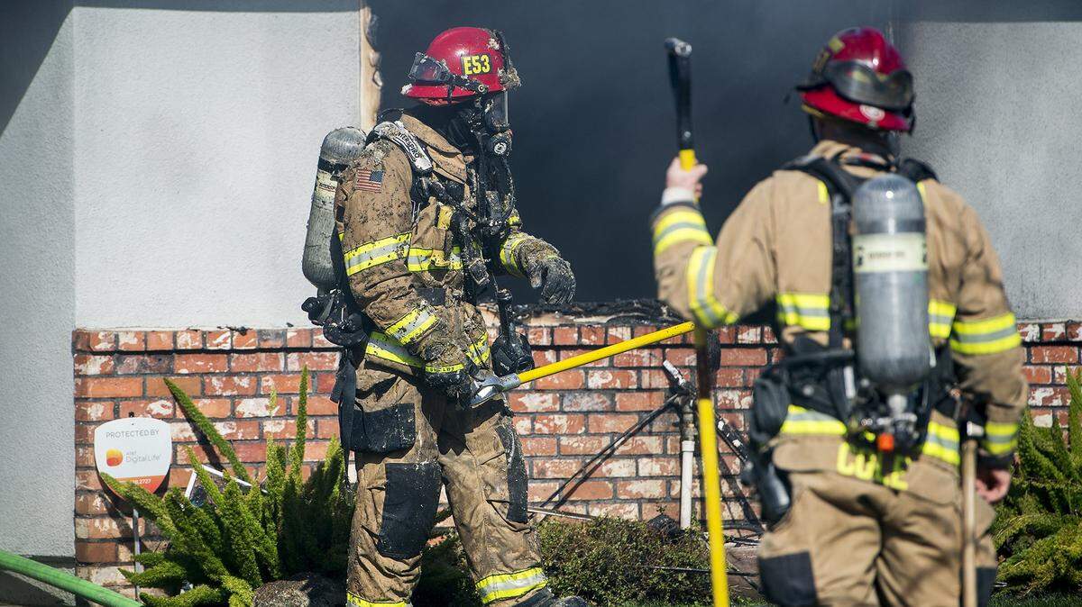 Members of the Merced Fire Department are shown responding to a house in March 2020.