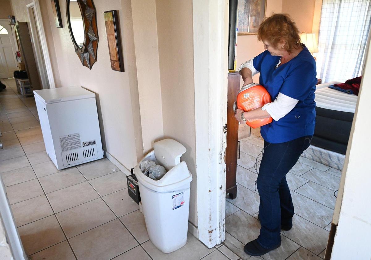 In-Home Support Services (IHSS) care worker Wendy Davenport helps helps with the laundry for her client Jovonna Martinez Wednesday, March 15, 2023 in Fresno. Davenport and other SEIU workers are looking for a salary increase from $16.10/hour to $20/hour for the work they do.