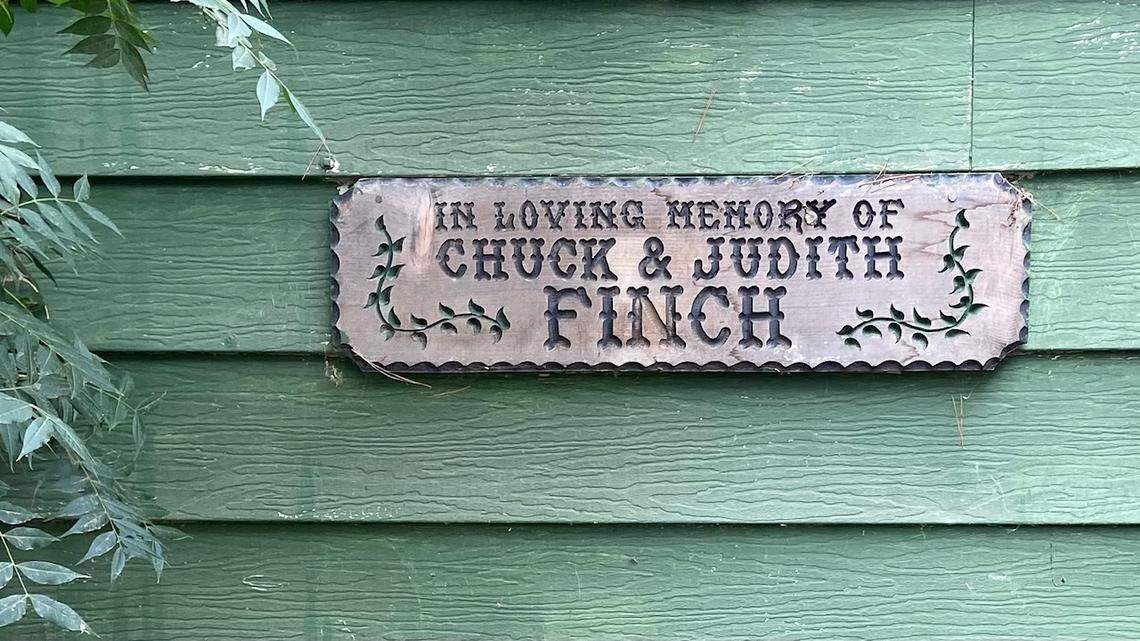 A sign commemorating Chuck and Judith Finch, Fort Washington Beach’s original owners/operators, is posted on the house near the entrance to the 10-acre campground and public boat launch along the San Joaquin River in Fresno, California.