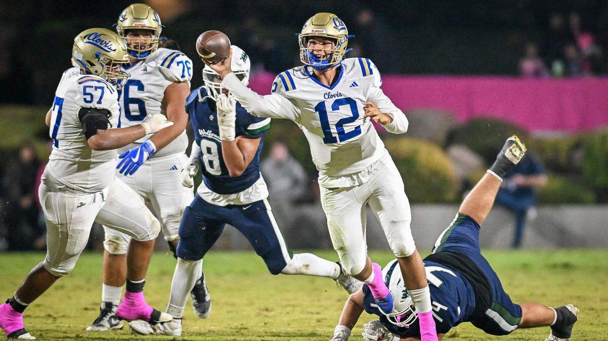 Clovis quarterback Deagan Rose pulls out of a potential sack while throwing to a receiver during their game against Clovis East at Lamonica Stadium in Clovis on Friday, Oct. 17, 2025.
