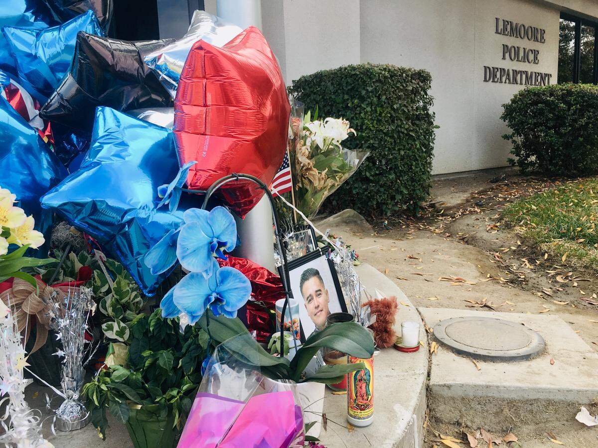 Balloons, flowers and candles outside the Lemoore Police Department on Nov. 15, 2019 to honor Lemoore Police Officer Jonathan Diaz, who was killed in Hanford on Nov. 2, 2019.