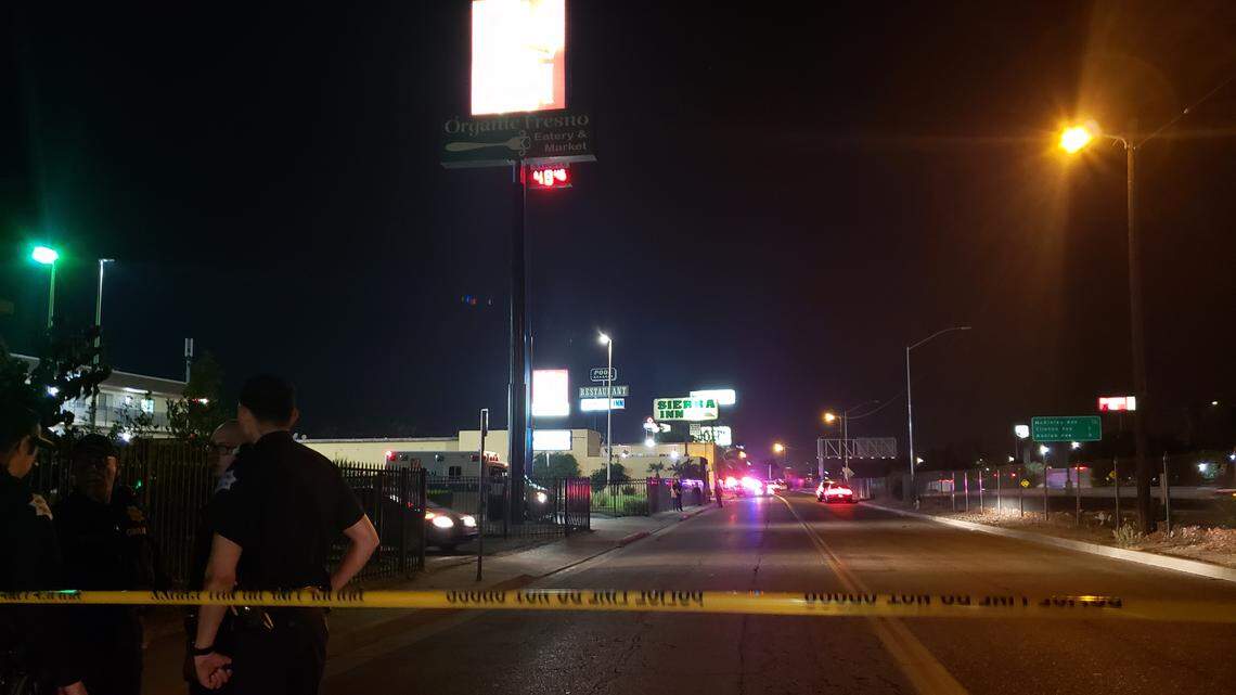 Police cordon off Parkway Drive just south of Olive Avenue on Friday night, July 20, 2018, during a standoff with a suspect in the Parkway Inn.