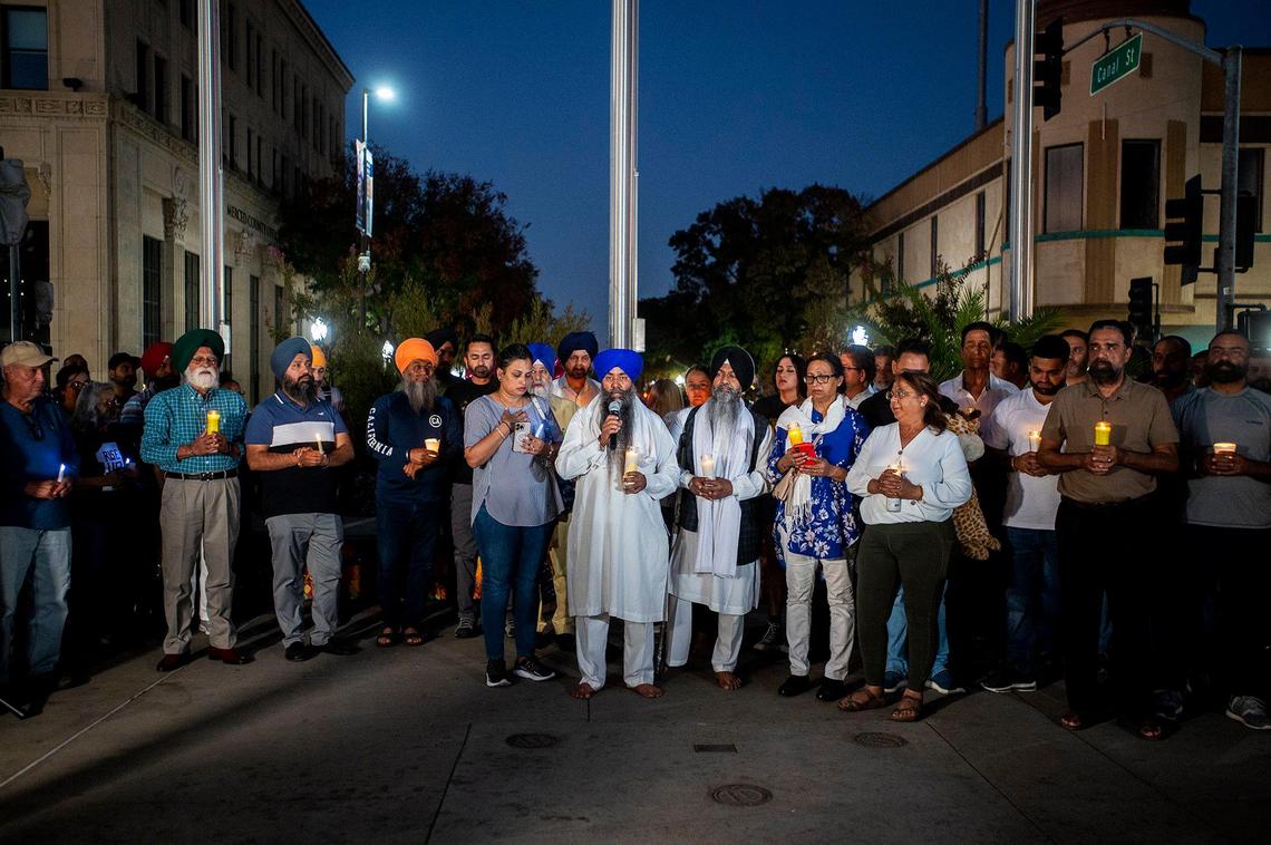 Community members gather during a vigil for 8-month-old Aroohi Dheri, her parents Jasleen Kaur, 27, and Jasdeep Singh, 36, and her uncle Amandeep Singh, 39, at Bob Hart Square in Merced, Calif., on Thursday, Oct. 6, 2022. The bodies of the four kidnapping victims were found in a rural area of Merced County north of Dos Palos on Wednesday. Authorities said the family was kidnapped at gunpoint Monday from a Merced County business.