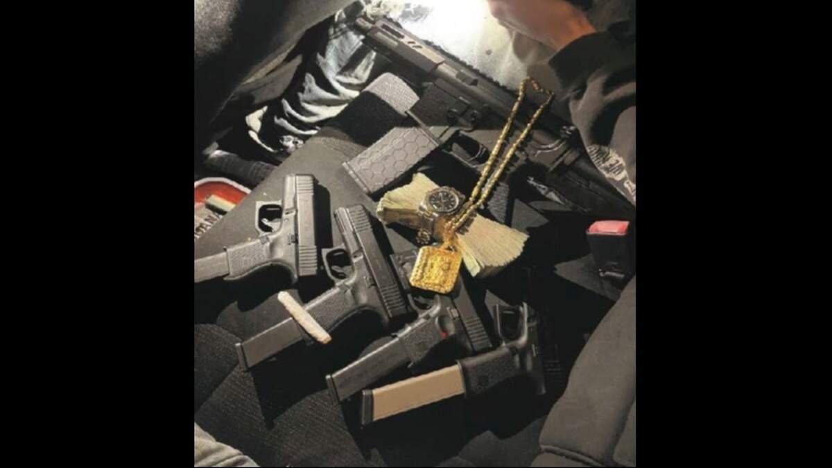 Guns seized by federal officials as part of a four-count indictment against five Fresno men