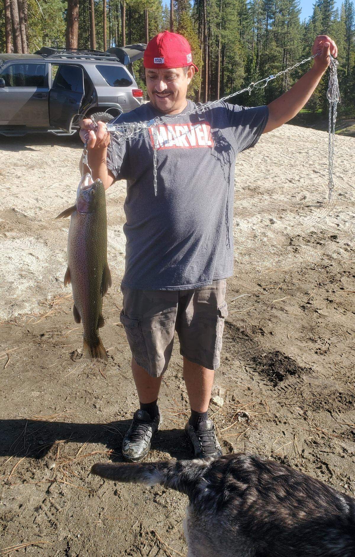 Oscar Yeppez shows off his personal-best, a 7.76-pound trout caught at Shaver Lake on Power Bait.
