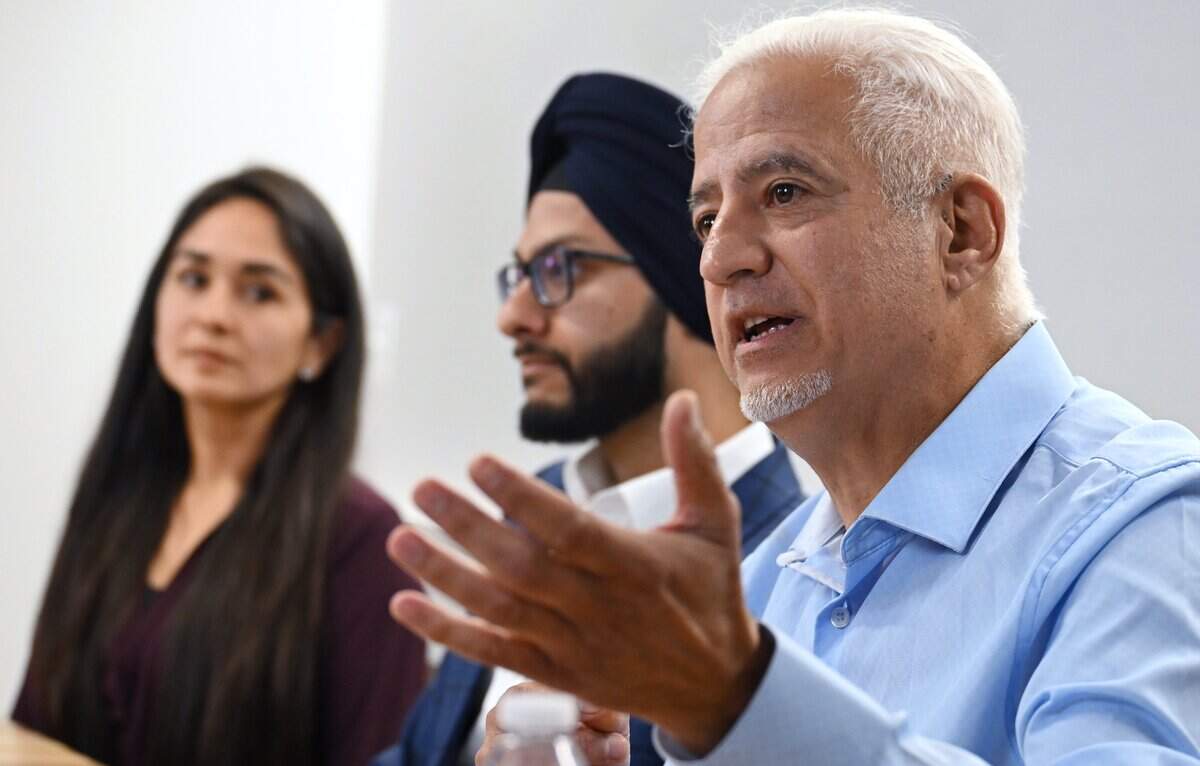 Dictrict 7 candidate AJ Rassamni, right, answers a question during a Fresno City Council District 7 forum held by The Fresno Bee Friday, April 17, 2026 in downtown Fresno