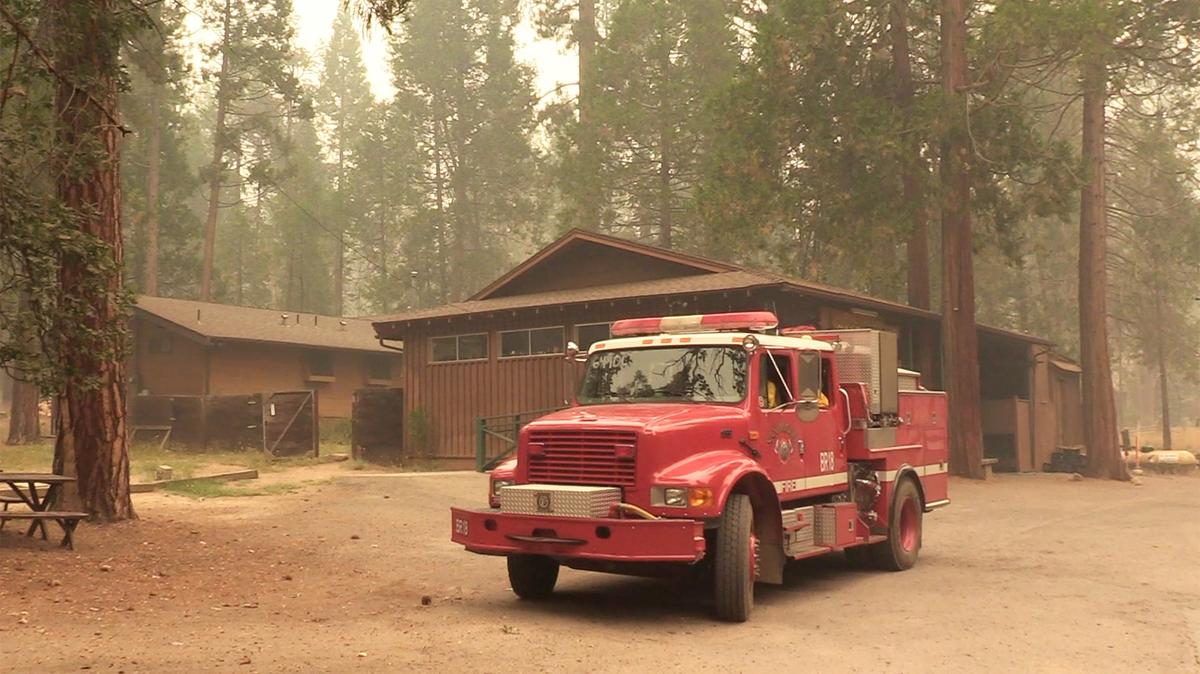 A fire truck keeps watch over the Pine Tree market in Wawona on Monday, Aug. 6, 2018. Yosemite National Park remains closed due to the Ferguson Fire but some residents of the private community of Wawona have been allowed to return to their homes. 