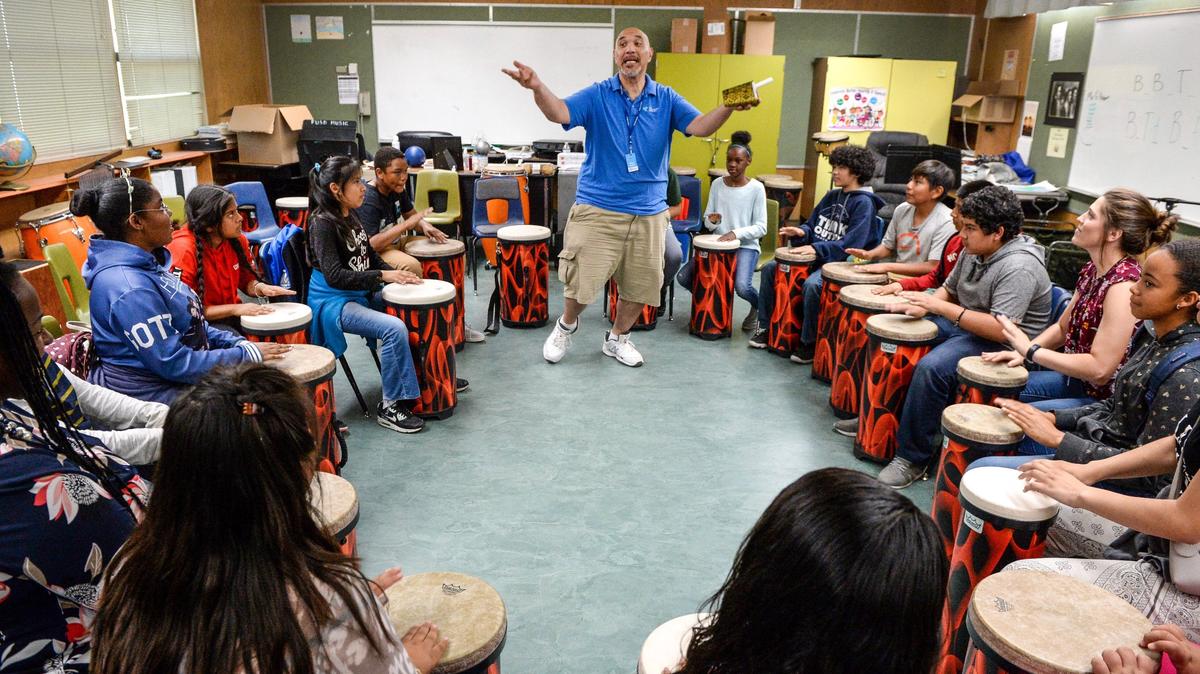 Brian Semsem, center, coordinates the drumming rhythm as Kirk Elementary School sixth graders participate in a drum circle class on Wednesday, May 9, 2019.