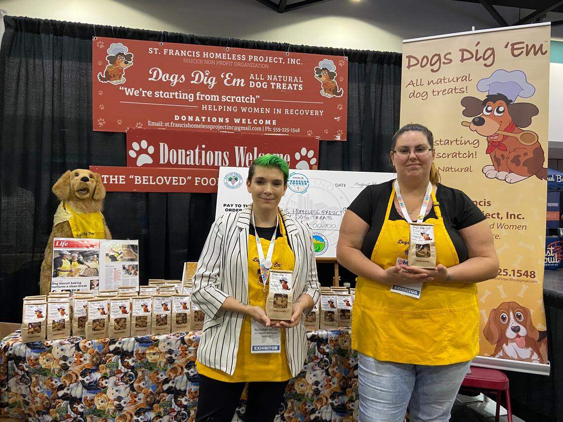 Workers at Dogs Dig ‘Em pose with the dog biscuits the nonprofit organization makes. Sales benefit the St. Francis Homeless Project, which helps train women with gaps in employment due to drug addiction, mental illness and human trafficking.