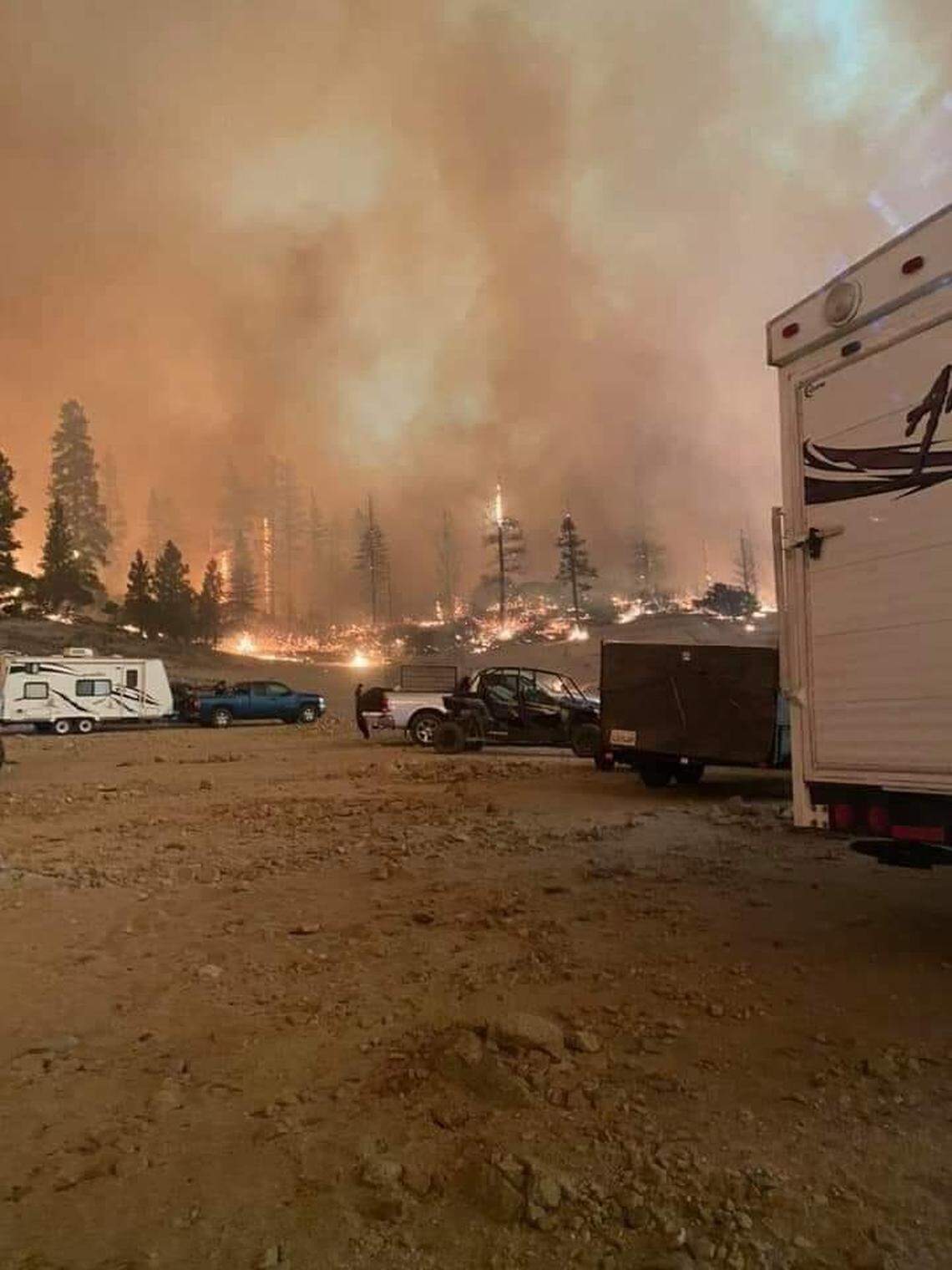 About 1,000 people were reported trapped near Mammoth Pool Reservoir, advised to shelter in place, in the water if necessary, as California’s Creek Fire burns.
