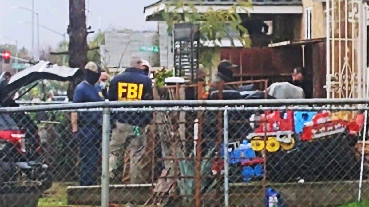 FBI agents gather at the home of Eddie Block Friday afternoon, Jan. 22, 2021 in Madera.