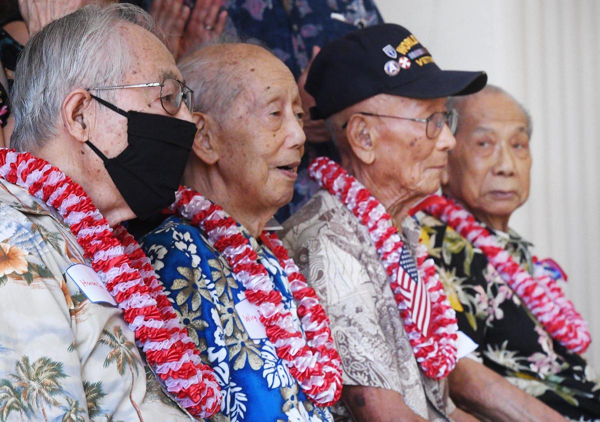 Four Chinese American WWII veterans, seated left to right, Hansen Chin, Wing Tuck Chin, Raymond Lee and Edward Sing Quan, receive medals and recognition in a ceremony attended by about 150 family and supporters at the Veterans Memorial Museum Saturday morning, June 26, 2021 in Fresno.