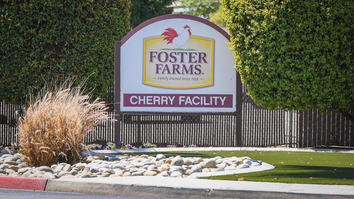 A sign stands outside the gate at the Foster Farms Cherry Avenue facility in Fresno on Wednesday, May 26, 2021.