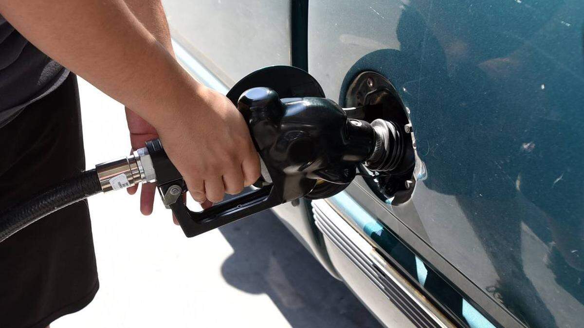 A Merced resident pumps gas at Valero station on G Street.