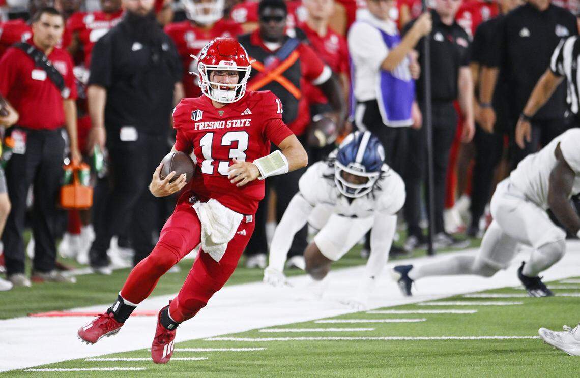Fresno State quarterback E.J. Warner scrambles way from defenders for yardage against Georgia Southern Saturday, Aug. 30, 2025 in Fresno.