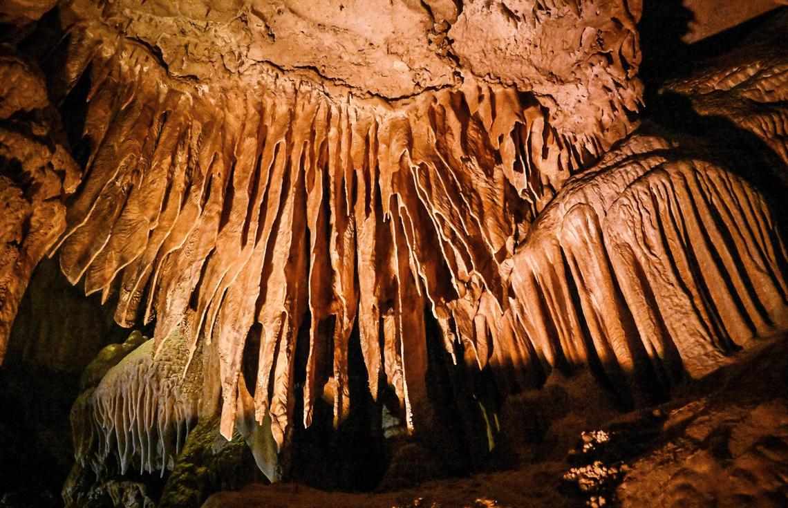 Calcium carbonate formations appear above the fairy pools in Crystal Cave where visitors can once again see inside the ancient cave after it’s reopening following years of being closed.