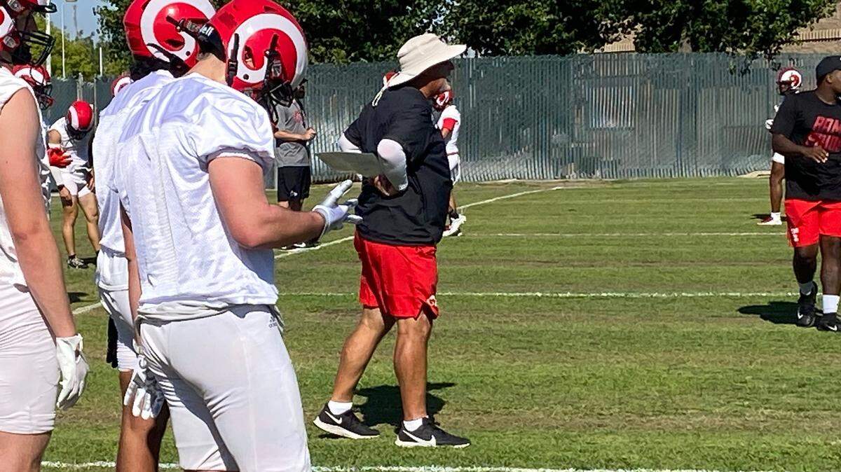 Fresno City College football coach Tony Caviglia gives instructions in a recent practice.