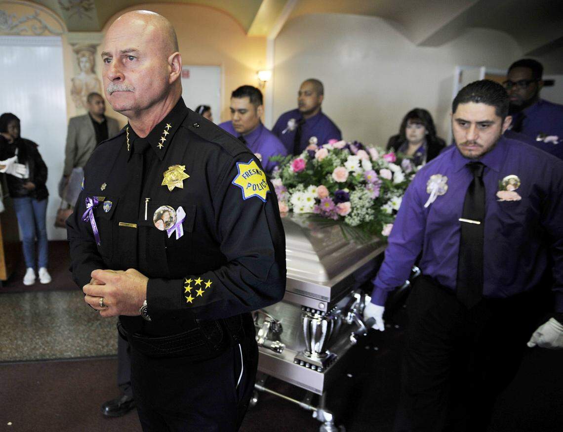 Fresno Police Chief Jerry Dyer walks in front of the pallbearers and the casket during the memorial service for Janessa Danielle Ramirez held at Cornerstone Church Saturday, January 24, 2015 in Fresno, Calif. Janessa, 9, was killed by a stray round fired Sunday, Jan. 18, as she stood with her mother outside a laundromat.