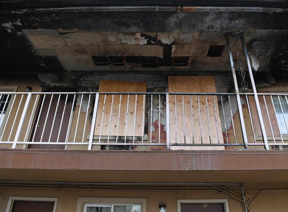 A second-floor room is boarded up at the Plaza Motel, the scene of a fire that left a man with severe burns and another person dead following the early-morning blaze Saturday, April 24, 2021, in downtown Fresno.