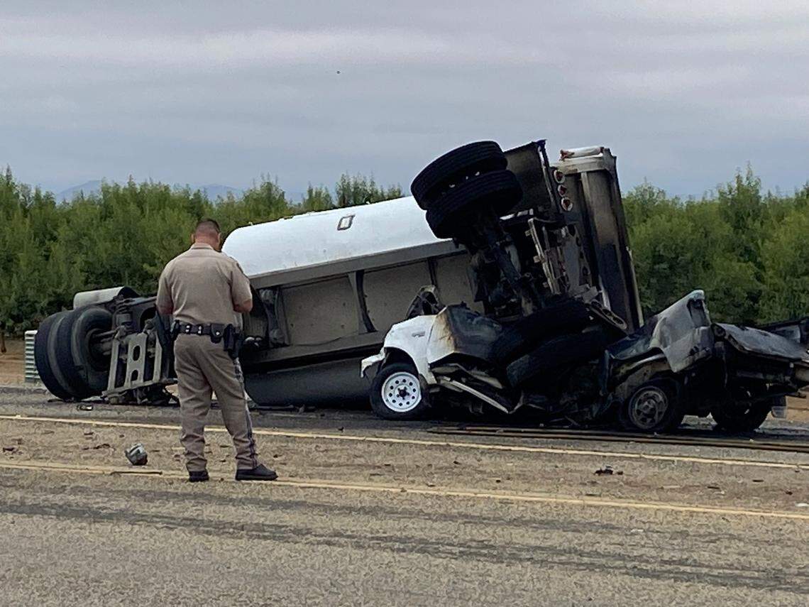 An officer surveys a fatal crash on Academy Avenue near Shields Avenue on Wednesday, June 7, 2023, in Fresno County, according to the California Highway Patrol.