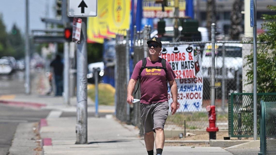 Fresno Bee columnist Marek Warszawski hikes along Blackstone Avenue, pictured just south of Ashlan Avenue Wednesday, May 8, 2024 in Fresno.