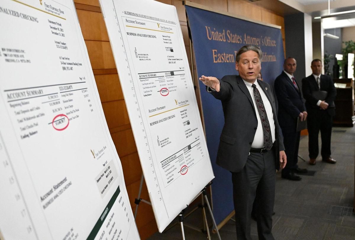 U.S. Attorney Phillip A. Talbert points out discrepancies between genuine bank statements for Bitwise Industries and altered bank statements allegedly provided by Bitwise co-founders and former co-CEOs Jake Soberal and Irma Olguin Jr., as he announced federal criminal charges of wire fraud against the pair. The announcement took place Thursday afternoon, Nov. 9, 2023, at the U.S. District Courthouse in Fresno, CA.