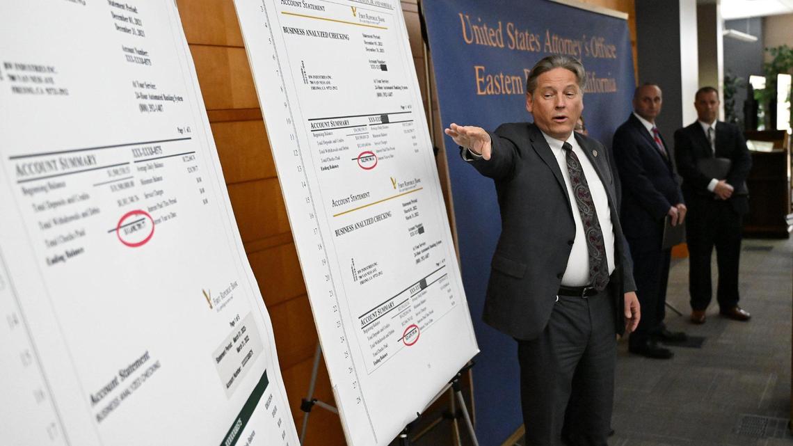 U.S. Attorney Phillip A. Talbert points out discrepancies between genuine bank statements for Bitwise Industries and altered bank statements allegedly provided by Bitwise co-founders and former co-CEOs Jake Soberal and Irma Olguin Jr., as he announced federal criminal charges of wire fraud against the pair. The announcement took place Thursday afternoon, Nov. 9, 2023, at the U.S. District Courthouse in Fresno, CA.