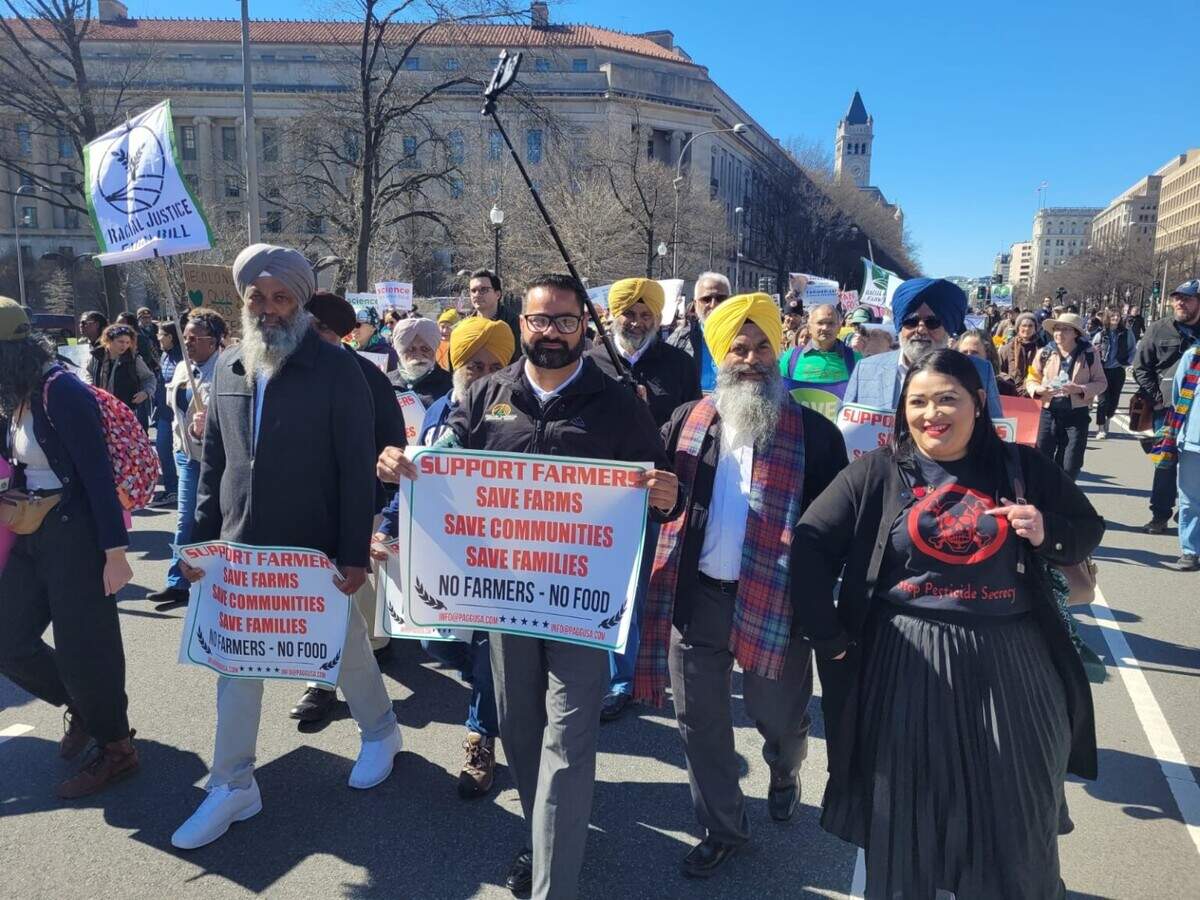 Amrik Basra, right front in yellow turban, attends a demonstration in 2023 in Washington D.C. supporting farmers.