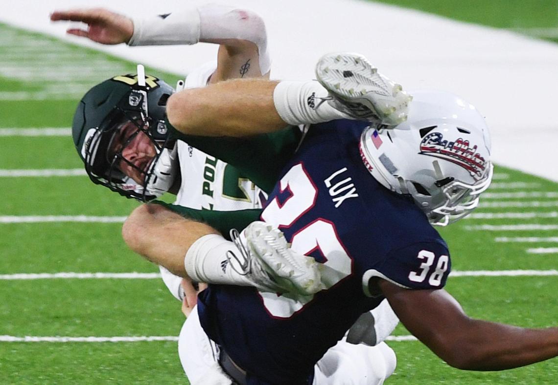Fresno State cornerback Bralyn Lux upends Cal Poly quarterback Spencer Brasch in the Bulldogs’ 63-10 victory over the Mustangs, Saturday, Sept. 11, 2021 in Fresno.