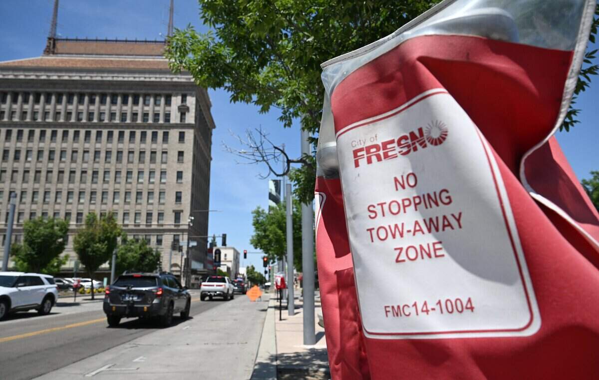 Parking meters along Fulton Street are seen covered Tuesday,, May 12, 2026 in downtown Fresno. Merchants claim their customers cannot find parking when shopping.