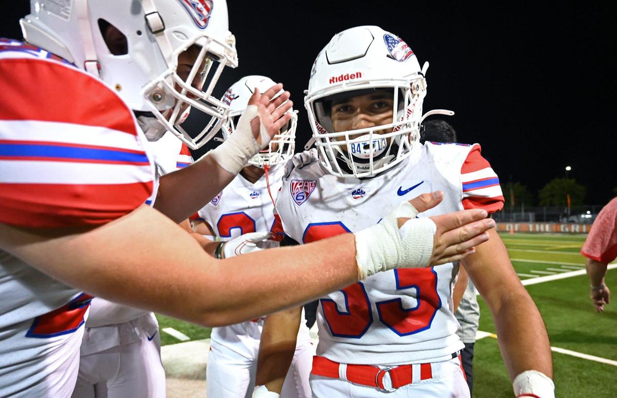 Buchanan’s Michael Runnels, right, is congratulated following the Bears’ 49-41 win against Central Friday, Oct. 7, 2022 in Fresno.