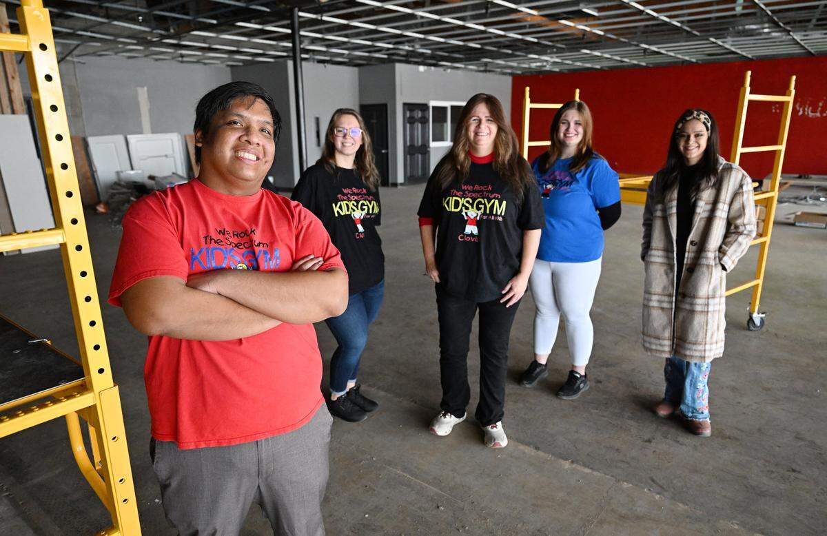 Christopher Reyes, left, shown with staff, talks about the upcoming opening of his new business called We Rock The Spectrum - Clovis, which as a sensory gym, will host a safe and friendly environment for children with autism. Photographed during a tour of the space Tuesday, Dec. 23, 2025 in Clovis, CA. 