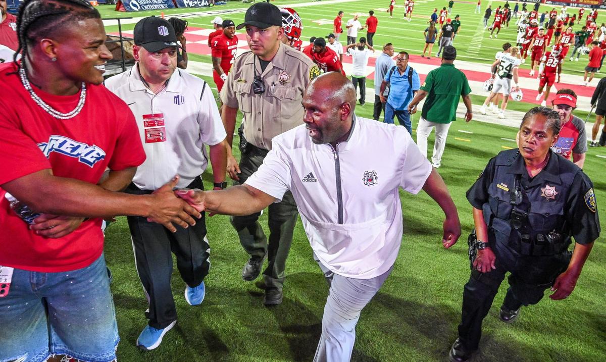 Fresno State interim head coach Tim Skipper is congratulated while leaving the field after the Bulldogs defeated Sacramento State for his first win as interim coach at Valley Children’s Stadium on Saturday, Sept. 7, 2024.