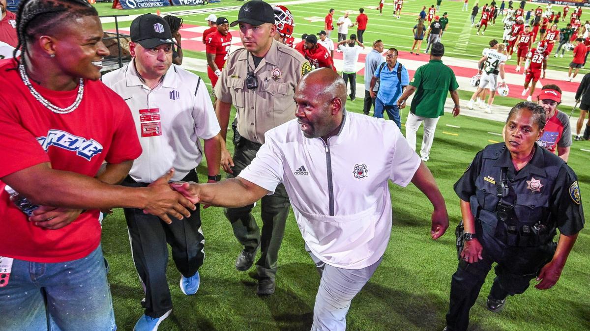 Fresno State interim head coach Tim Skipper is congratulated while leaving the field after the Bulldogs defeated Sacramento State for his first win as interim coach at Valley Children’s Stadium on Saturday, Sept. 7, 2024.