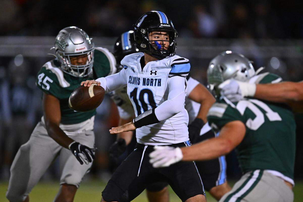 Clovis North quarterback Mario Cosma (10) throws the ball while being pressured by the De La Salle defense in the third quarter of their NorCal Division I-AA regional championship game at De La Salle High School in Concord, Calif., on Friday, Dec. 1, 2023. De La Salle defeated Clovis North 41-0.