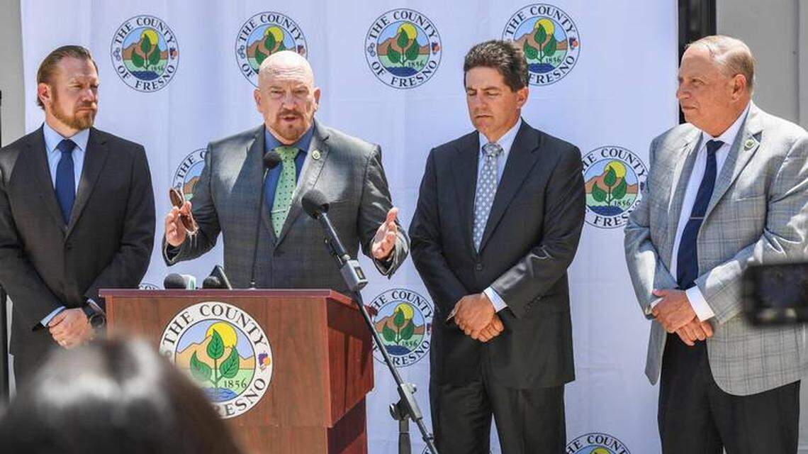 Fresno County Supervisor Steve Brandau speaks at an August 2021 news conference flanked by fell board members, from left, Nathan Magsig, Brian Pacheco and Buddy Mendes.